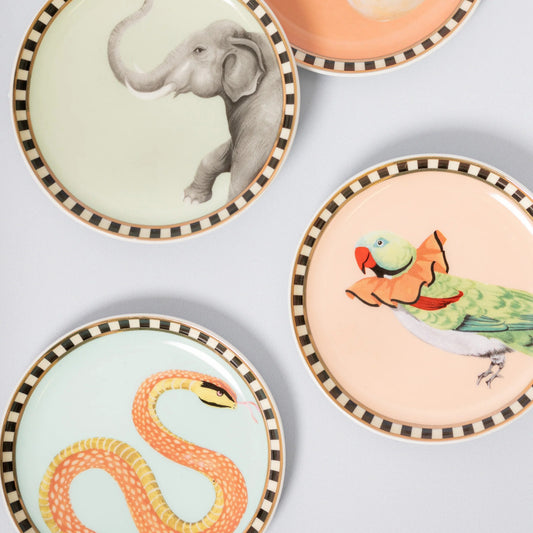 keramieken onderzetters met dieren zoals slang, olifant papegaai en muisje. Yvonne Ellen London